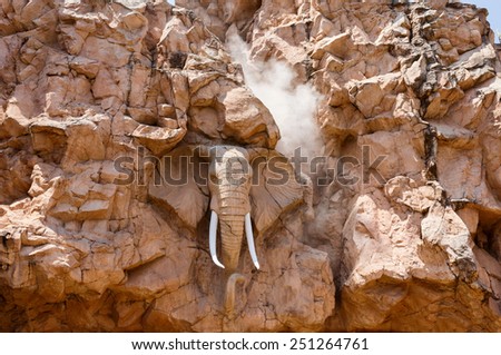 African elephant head relief, artificial rocks in Sun City, South Africa with steam