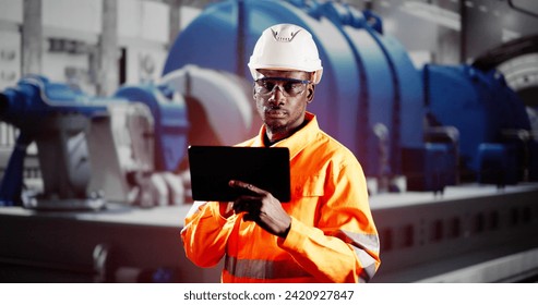 African Engineer Man Checking Industrial Facility. Osha Inspection - Powered by Shutterstock