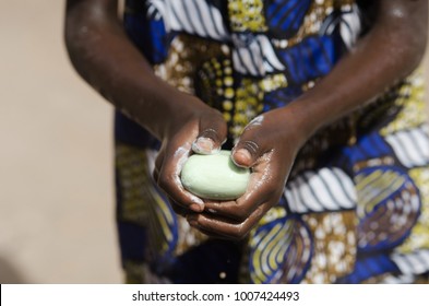 African Ethnicity Black Boy Washing Hands Outdoors With Water