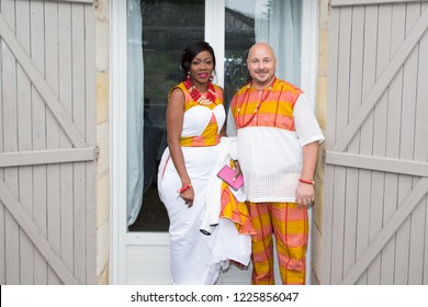 African Family In Bright Ethnic Clothes In Front Of House For Wedding Mixed Race Interracial American Couple