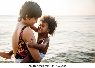 African family enjoying the beach - Shutterstock ID 1121576636