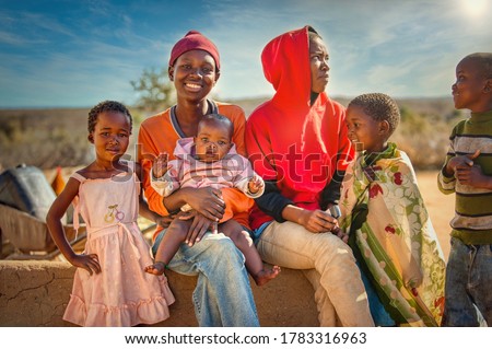 African family group of kids and teenagers,  village in Botswana