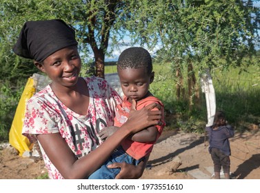 African Family Mother And Children Together In A Village In Botswana