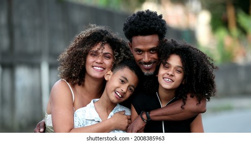 African Family Portrait Standing For Photo Outside. Smiling Black Parents And Kids