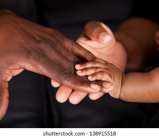 An african family's hands coming together