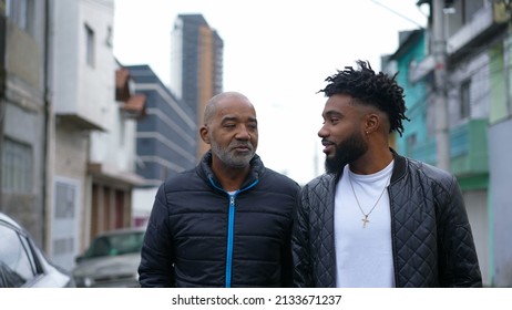 An African Father And Adult Son Walking Together Outside In Urban Street Two People Bonding