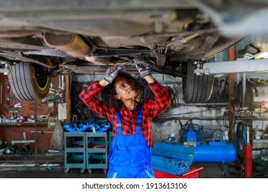 African Female auto mechanic working at the repair shop. - Powered by Shutterstock