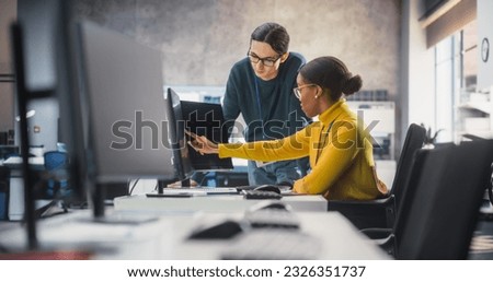 African Female and Caucasian Male Students Working Together in Infographics Class, Collaborating on a College Project. Diverse Scholars Talking, Study and Prepare for Computer Science Exams