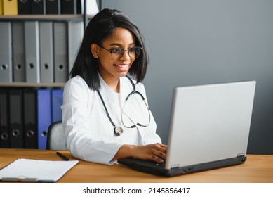 African Female Doctor Make Online Telemedicine Video Call Consult Patient. Afro American Black Woman Therapist Talking To Camera In Remote Videoconference Chat. Webcam View, Face Headshot