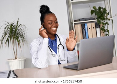 African female doctor talk with patient make telemedicine online webcam video call. Black woman therapist videoconferencing on computer in remote telemedicine laptop virtual chat. Telehealth concept