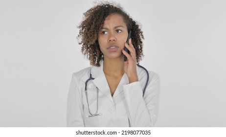 African Female Doctor Talking On Phone On White Background