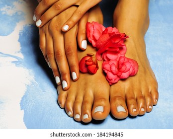 African Female Feet And Hand, Blue Pedicure With Pink Flower