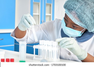 African Female Tech, Technical Assistant, Working With Mouth Swabs, Patient Samples For Detection Of Covid-19, SARS-CoV-2 Novel Coronavirus. Medical Test Lab, Research Laboratory, Testing Facility.