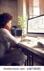 African Female Works On Computer In Architect Project Office