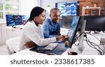 African Financial Data Analysts Using Performance Dashboard On Screens In Office