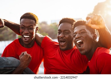 African football fans having fun supporting their favorite team - Sport entertainment concept - Shutterstock ID 2214032947