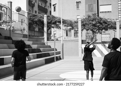 African Friends Playing Basketball Outdoor - Focus On Center Girl Face - Black And White Editing