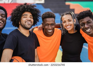 African friends playing basketball outdoor - Focus on man face holding ball - Powered by Shutterstock