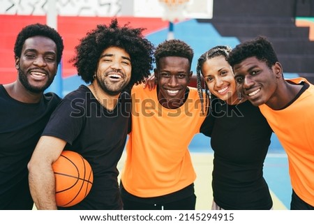 African friends playing basketball outdoor - Urban lifestyle concept - Focus on center guy face