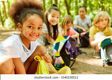 African girl and friends take a rest on the tour - Powered by Shutterstock