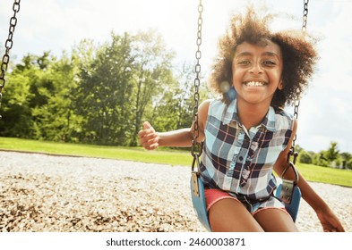 African girl, portrait and smile with swing, park and nature for outdoor fun or play with fresh air. Child, joy and playground with summer, freedom and school holiday or break outside with happiness - Powered by Shutterstock