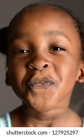 African Girl Pressing Her Face Against A Window