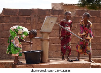 African Girls Busy At Taking Clean And Fresh Drinking Water