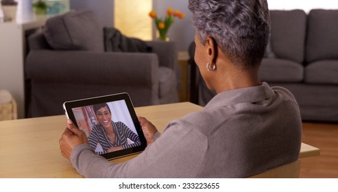 African Grandma Video Chatting On Tablet