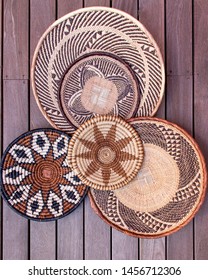 African Grass Baskets On A Wooden Background 