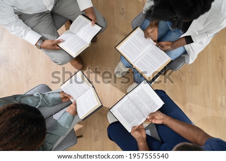 African Group Of People Reading Religious Book Together