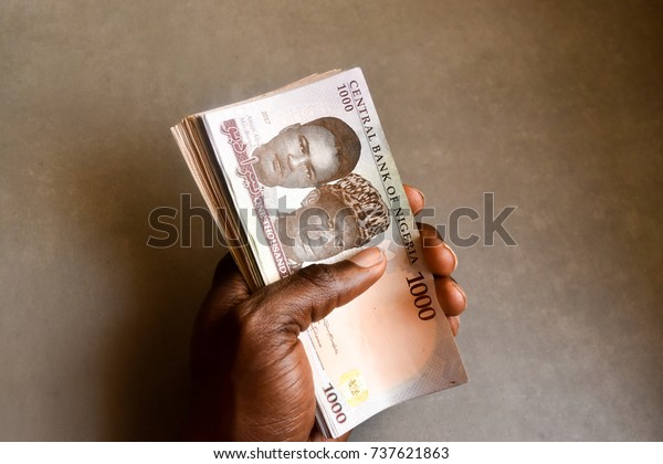 African Hand Holding Stack One Thousand Stock Photo Edit Now 737621863