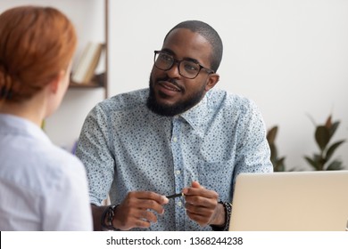 African Hr Manager Listening To Caucasian Female Applicant Asking Questions At Job Interview Business Meeting, Diverse Recruiter Employer And Seeker Client Talking, Human Resource, Recruiting Concept