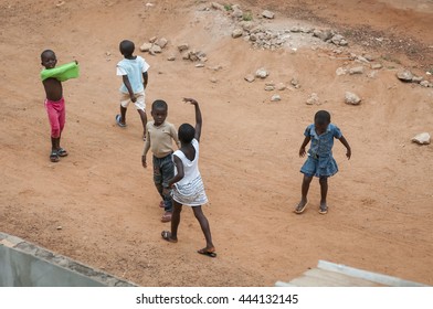 African Ivorian Children Playing In The Street. Daloa, Ivory Coast, West Africa, July 2013. Cote D'Ivoire People, Benin, Togo, Gambia, Namibia, Ghana, Sudan, Guinea, Sierra Leone, Burkina Faso, Mali