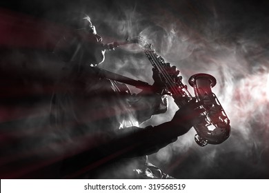 African jazz musician playing the saxophone. Black and white with color flare