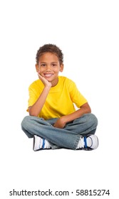 African Kid Boy Sitting On Floor