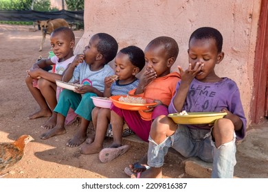 African Kids Eating Some Sorghum Porridge, Village In Botswana