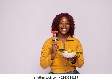 African Lady With A Bowl Of Fruit Salad