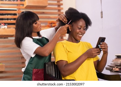 African Lady Checking Her Phone Call While Is Being Done