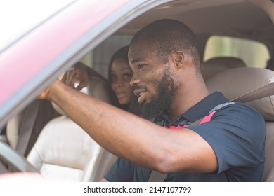 African Lady Giving A Driver Directions