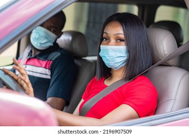 African Lady And Passenger Wearing Face Mask While Driving