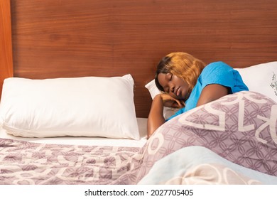 African Lady Sleeping In Her Room