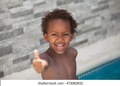 African Little Kid Three Years In The Pool On Summer