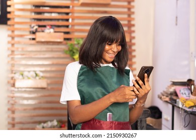 African Makeup Artist Checking Her Phone