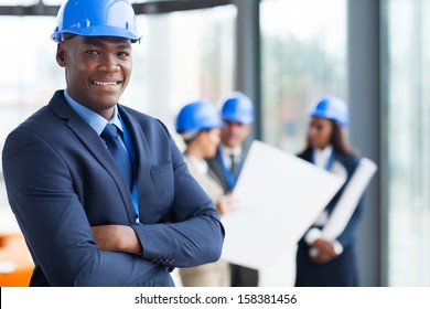 African Male Construction Manager With Arms Folded