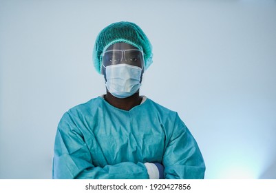 African Male Doctor Wearing Protective Face Mask For Coronavirus Outbreak Inside Laboratory