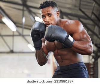 African man, boxing and punch in gym for fitness, focus or training for growth, goal and wellness for competition. African guy, boxer and gloves for exercise, wellness or martial arts club for sports - Powered by Shutterstock