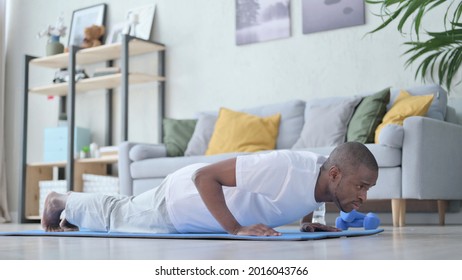 African Man Doing Pushups On Yoga Mat At Home