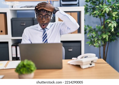 African Man With Dreadlocks Wearing Call Center Agent Headset Stressed And Frustrated With Hand On Head, Surprised And Angry Face 