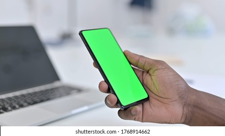 African Man Hand Using Green Smartphone Screen, Chroma key