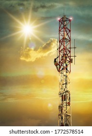 African man inspecting and performing maintenance on a cellphone tower